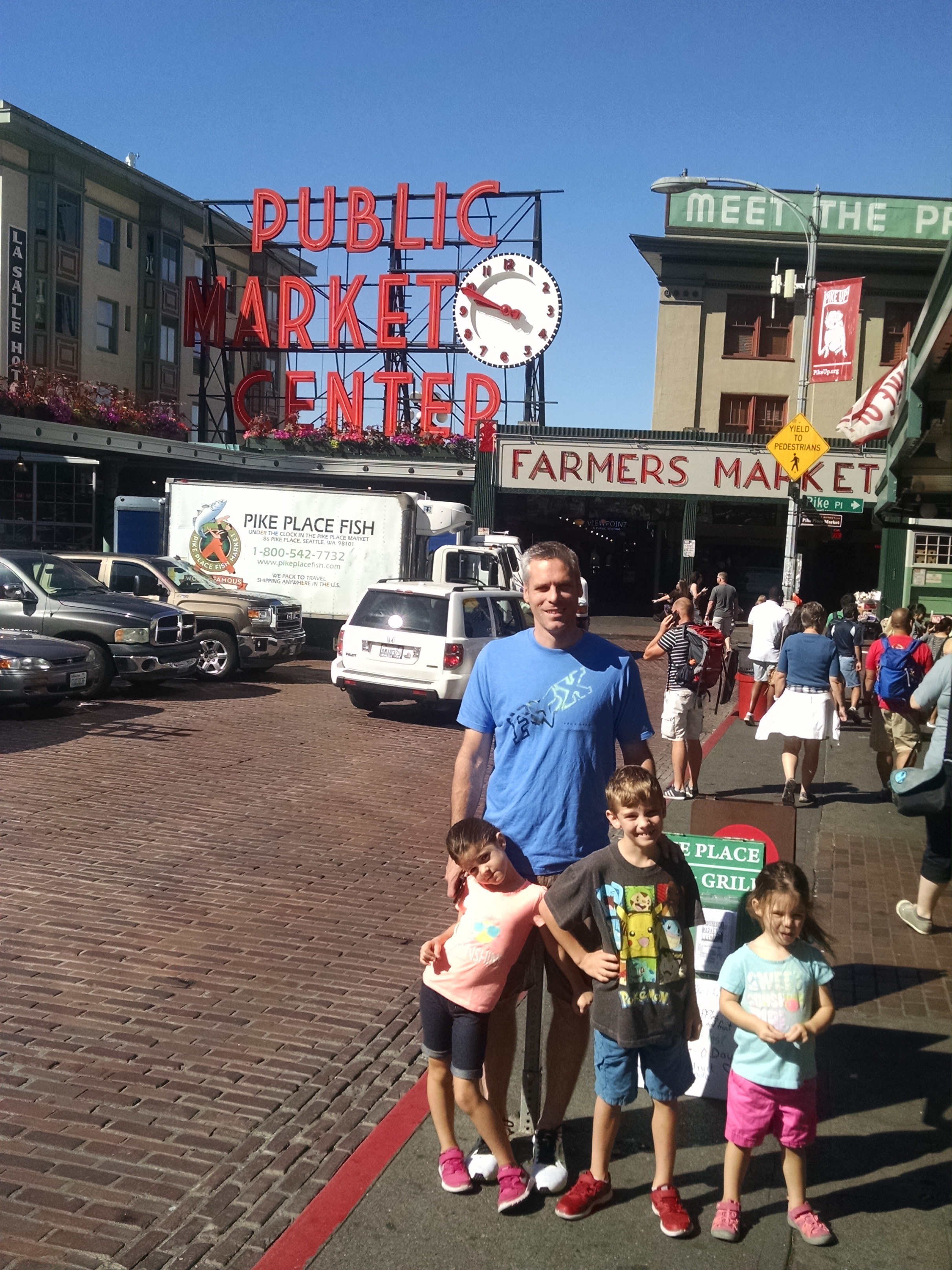 family in from of seattle's public market center or Pikes place